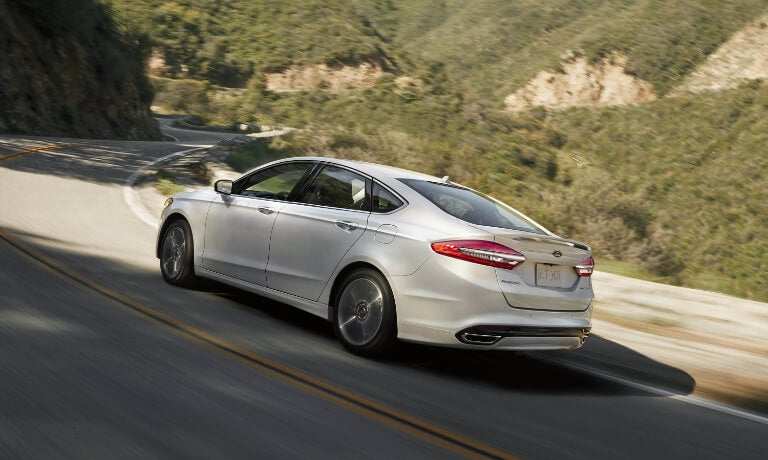 2020 Ford Fusion Exterior Taking A Curve On A Forested Highway