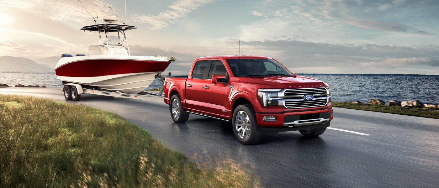 2024 Ford F-150 Exterior Towing A Boat By Lake